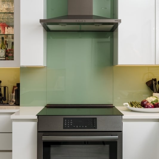 Range with green glass backsplash