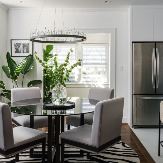 Dining area with round light fixture