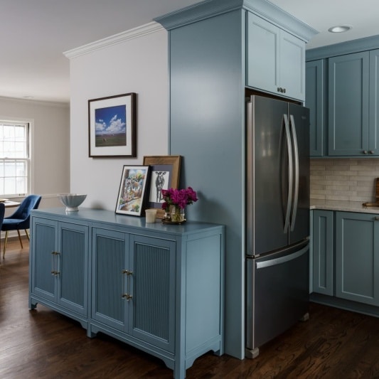 Kitchen and dining area with light blue cabinets