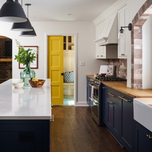 freshly remodeled kc kitchen with pop of color yellow sliding door