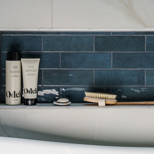 blue subway tile shower niche details in spa like wetroom