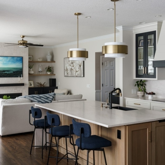 modern sleek glam main floor remodel with black and white details and gold accents and white oak island
