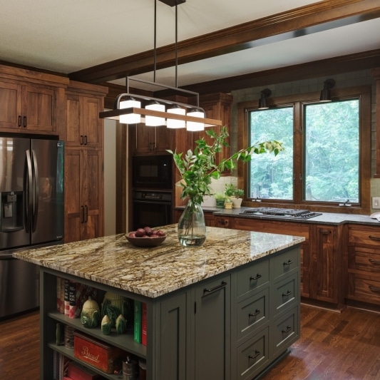 modern craftsman inspired kitchen with warm wood tones and dark earth tones