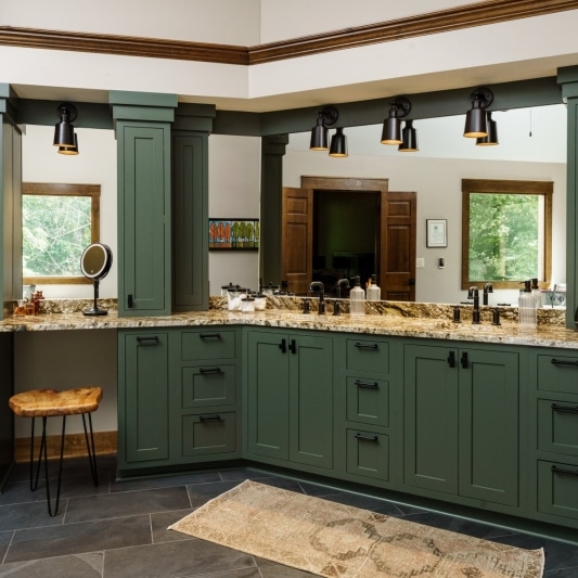 green primary bathroom cabinetry