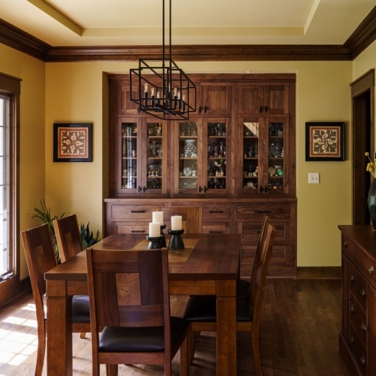 warm wood tones in built-in shelf in dining room