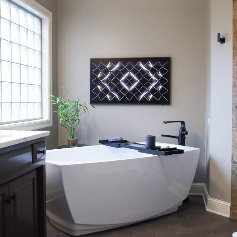 spa like primary bath remodel with large soaking tub near window