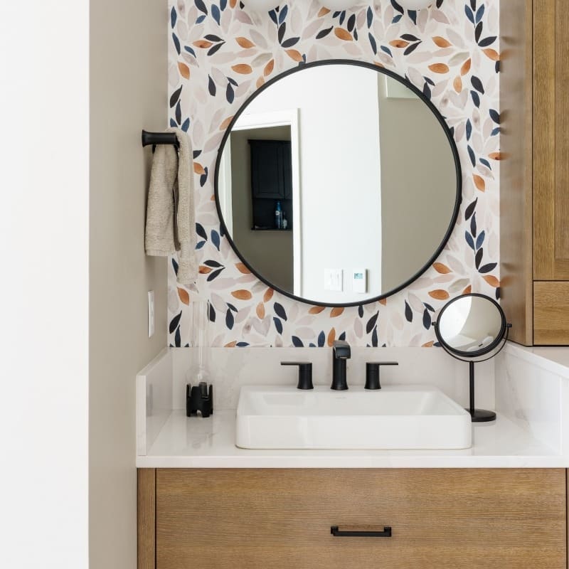 modern sleek primary bath with floral leaf wallpaper. spa like calming bright vibes