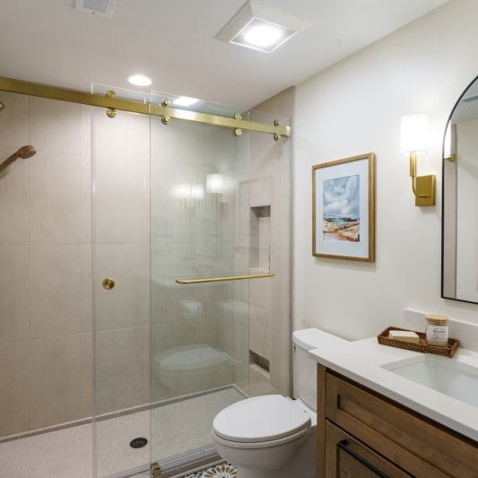Basement bathroom with onyx shower, printed tile floor, white oak vanity