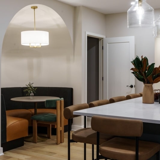 Built-in banquette with dome ceiling, light fixture, booth with leather seat