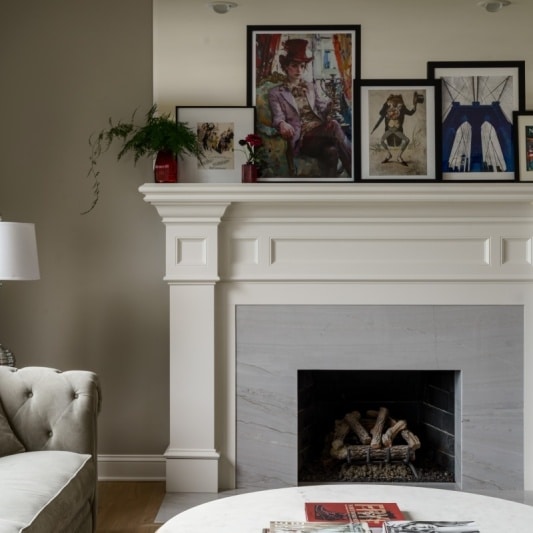 traditional fireplace with sleek stone slab added for more modern look