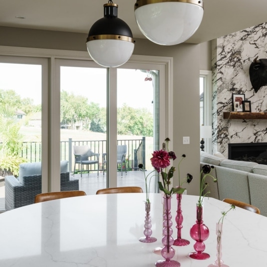 modern dramatic main floor remodel with full slabs of porcelain on the fireplace for a sleek look