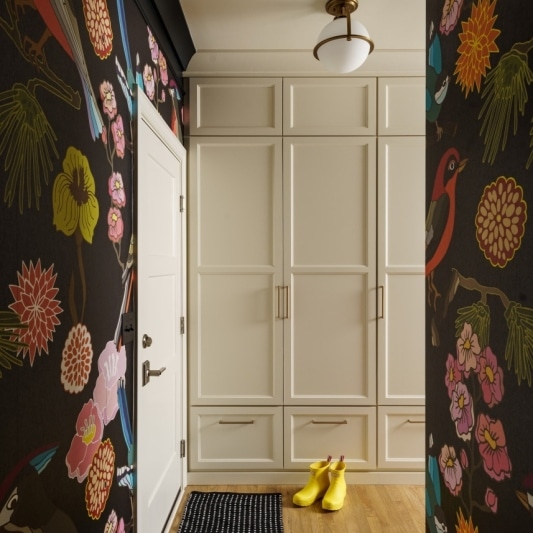 statement mudroom entryway landing with black bird and floral wallpaper