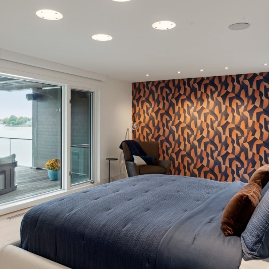 contemporary whole home remodel with retro inspired wallpaper and statement design details in primary suite and bathroom. Navy and burnt orange rust add some personality