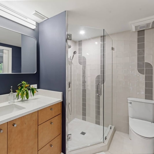 contemporary bathroom with retro inspired tile and deep purple grey paint color