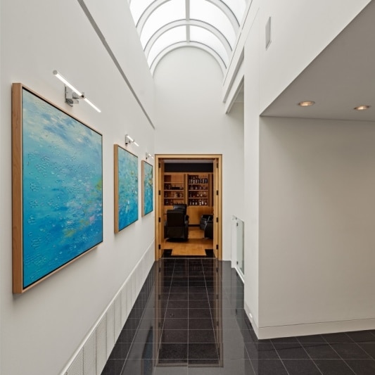 contemporary whole home remodel with skylight arched ceiling in upstairs hallway