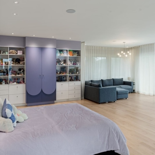 upstairs bedroom with built in closet and storage area