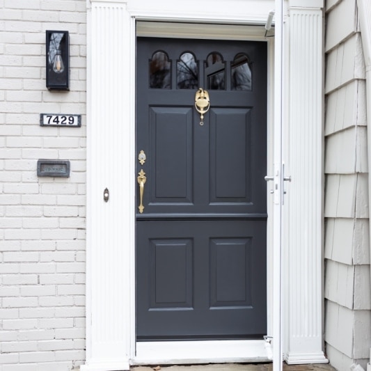 dutch door remodel with dark storm grey paint and brass hardware