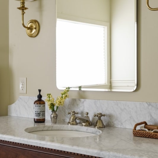 Classic charm dark stained oak vanity in primary bath remodel