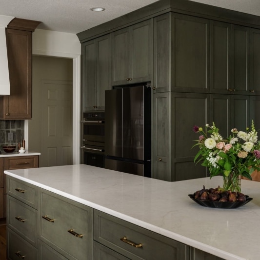 earth tone kitchen with warm wood oak and gold accents for moody modern design