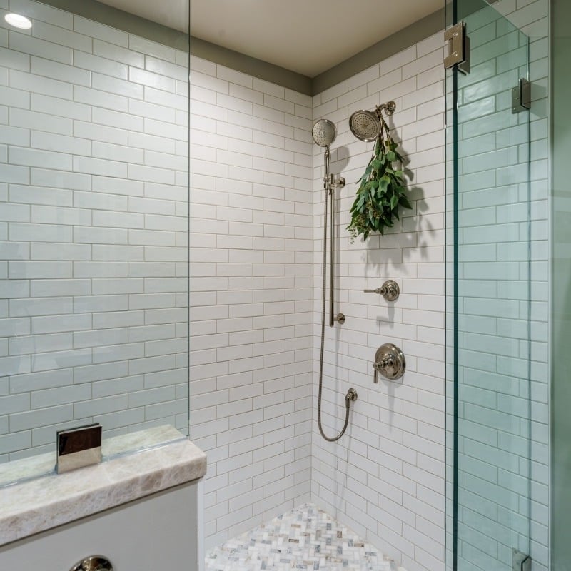 large spa like walk in shower with classic white subway tile