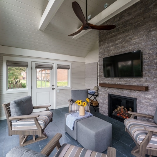 3 seasons room with electric fireplace and vaulted ceiling
