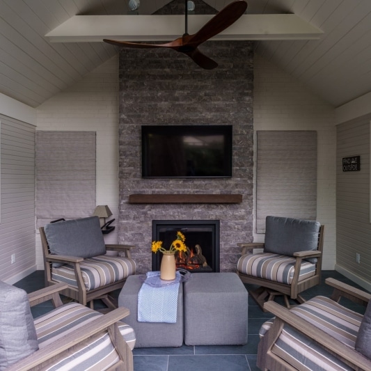 3 seasons room with electric fireplace and vaulted ceiling