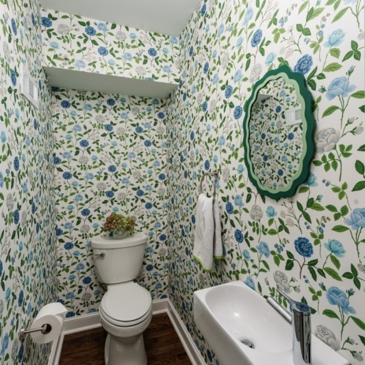 powder bath with blue and green floral wallpaper