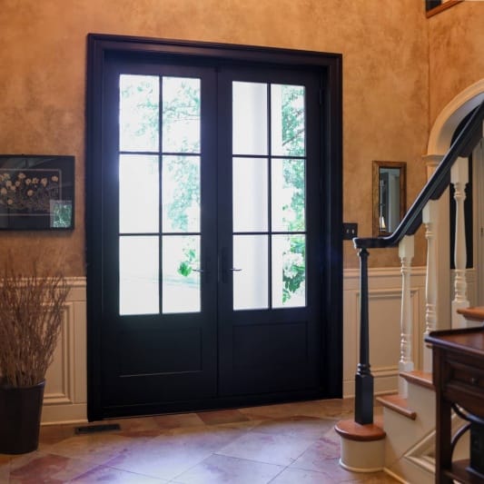sleek modern update for a traditional home with new transom and french doors