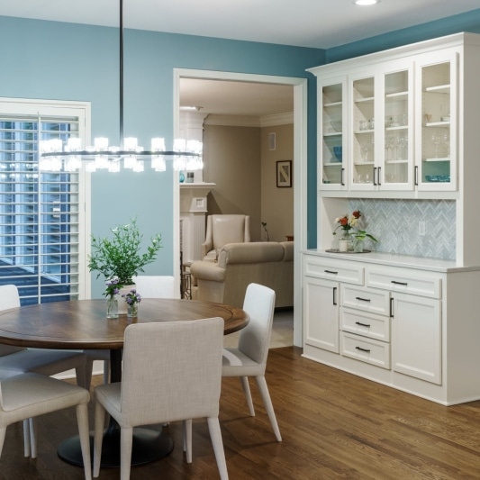 Dining area with white built-in hutch