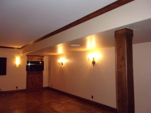 View of basement before. Wall with two lights were screen will go.