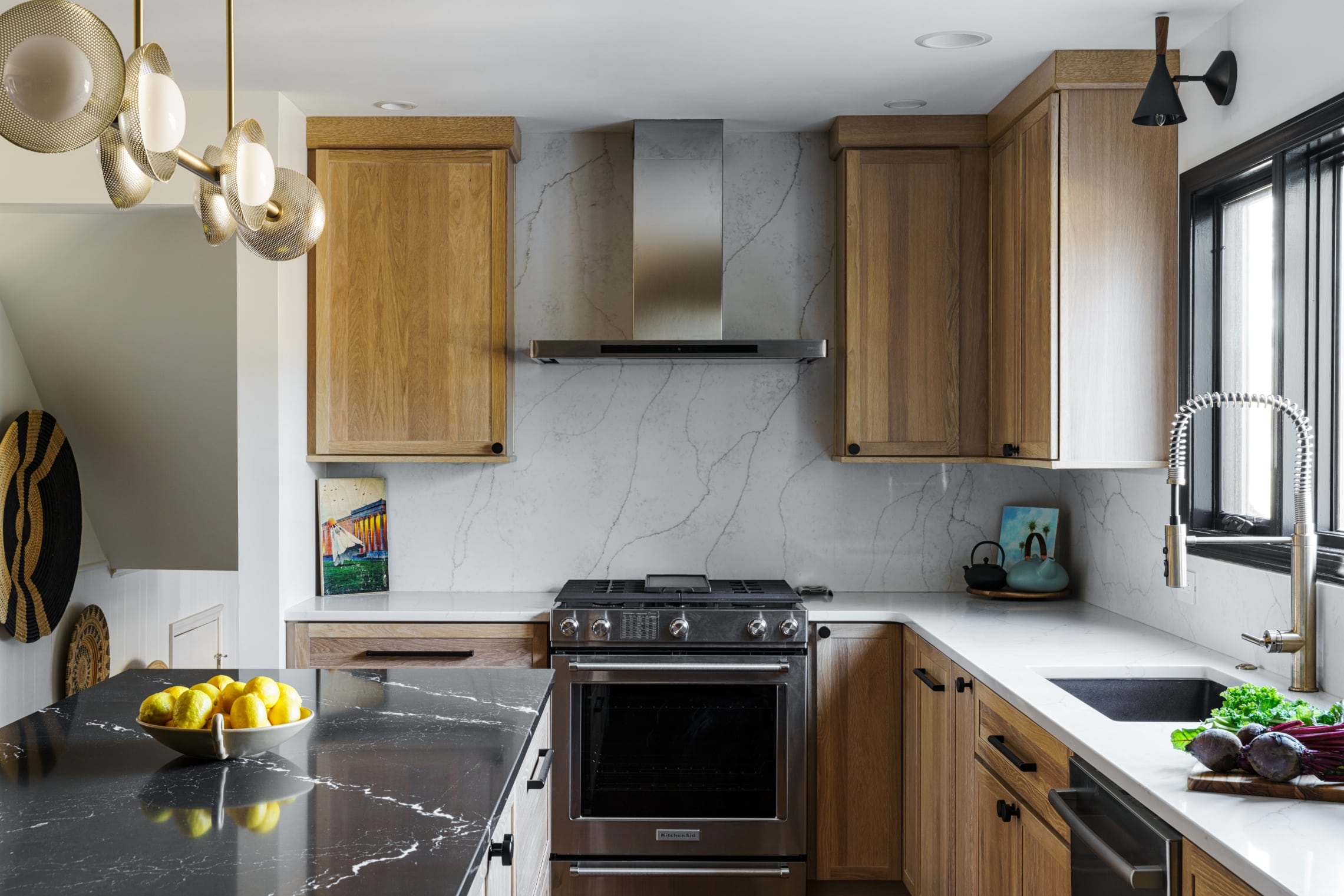 Full heigh quartz backsplash in kitchen
