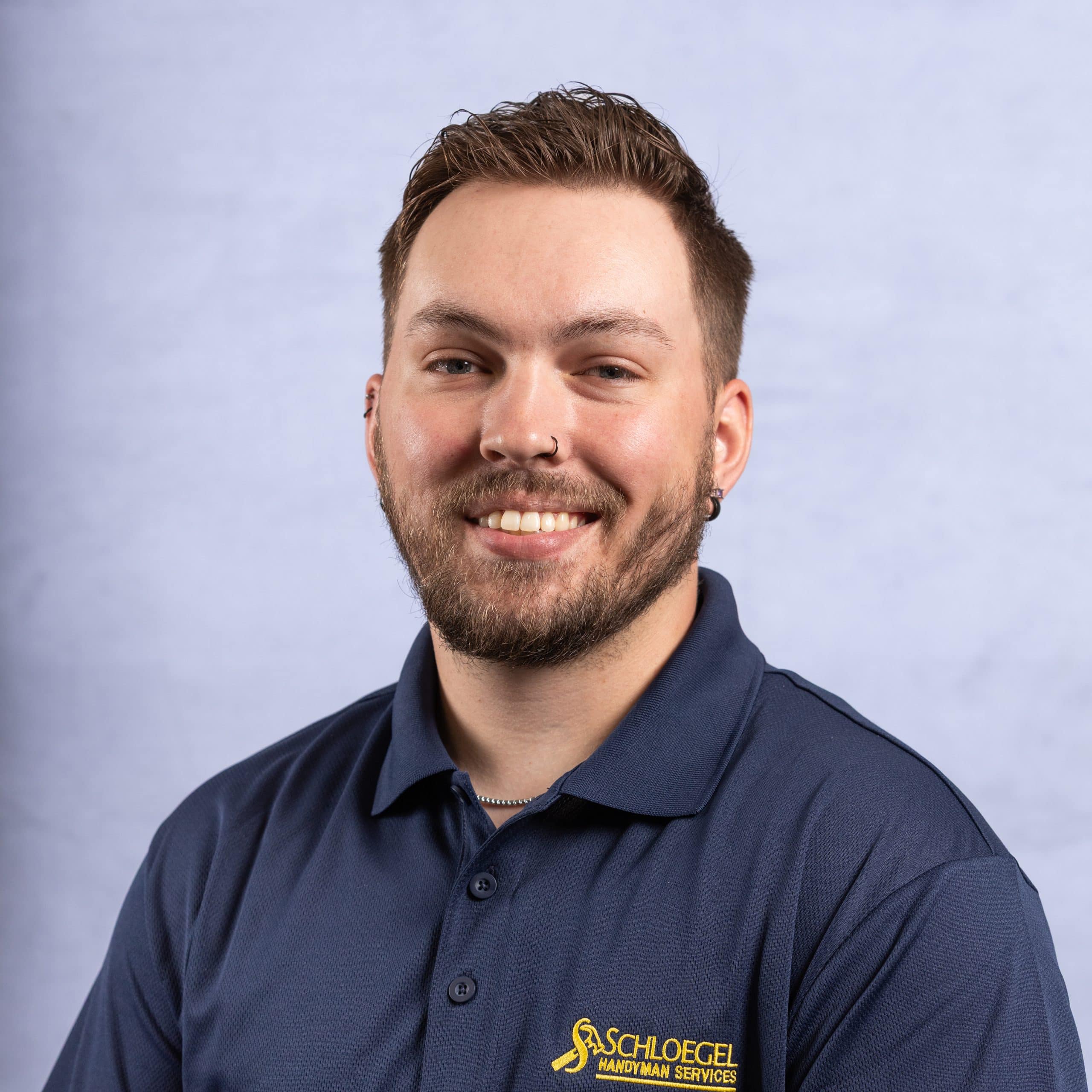 Profile headshot of remodeling expert and handyman team member at Schloegel Design Remodel, Cody Harding. 