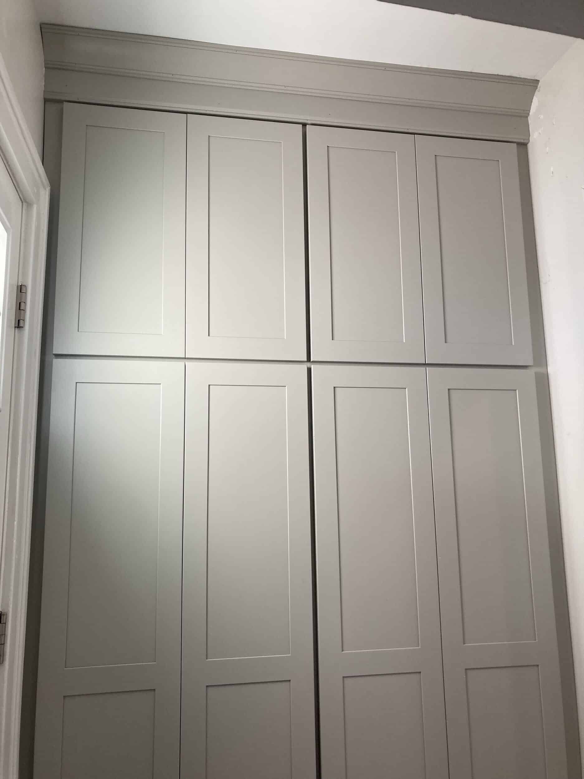 new custom cabinetry for mudroom storage nook area right off kitchen to help blend existing elements with the new. adds ample storage and is a bright creamy white shade