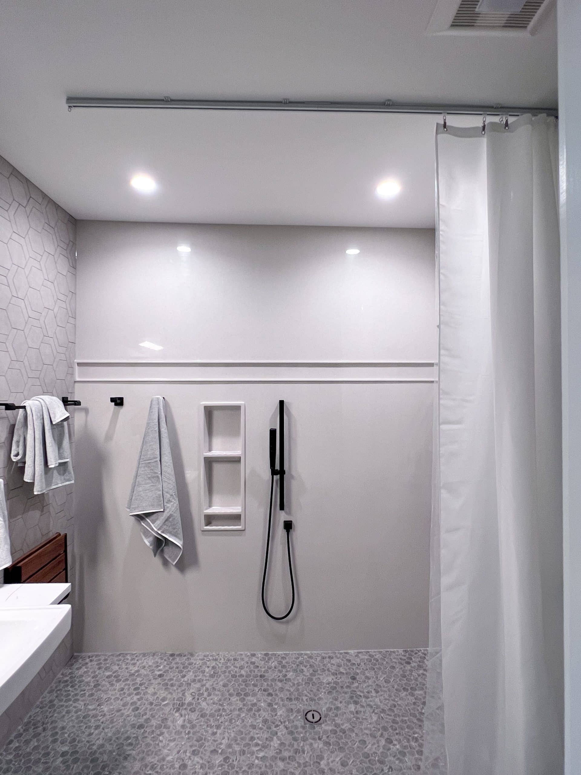 Shower mounted curtain in wet room
