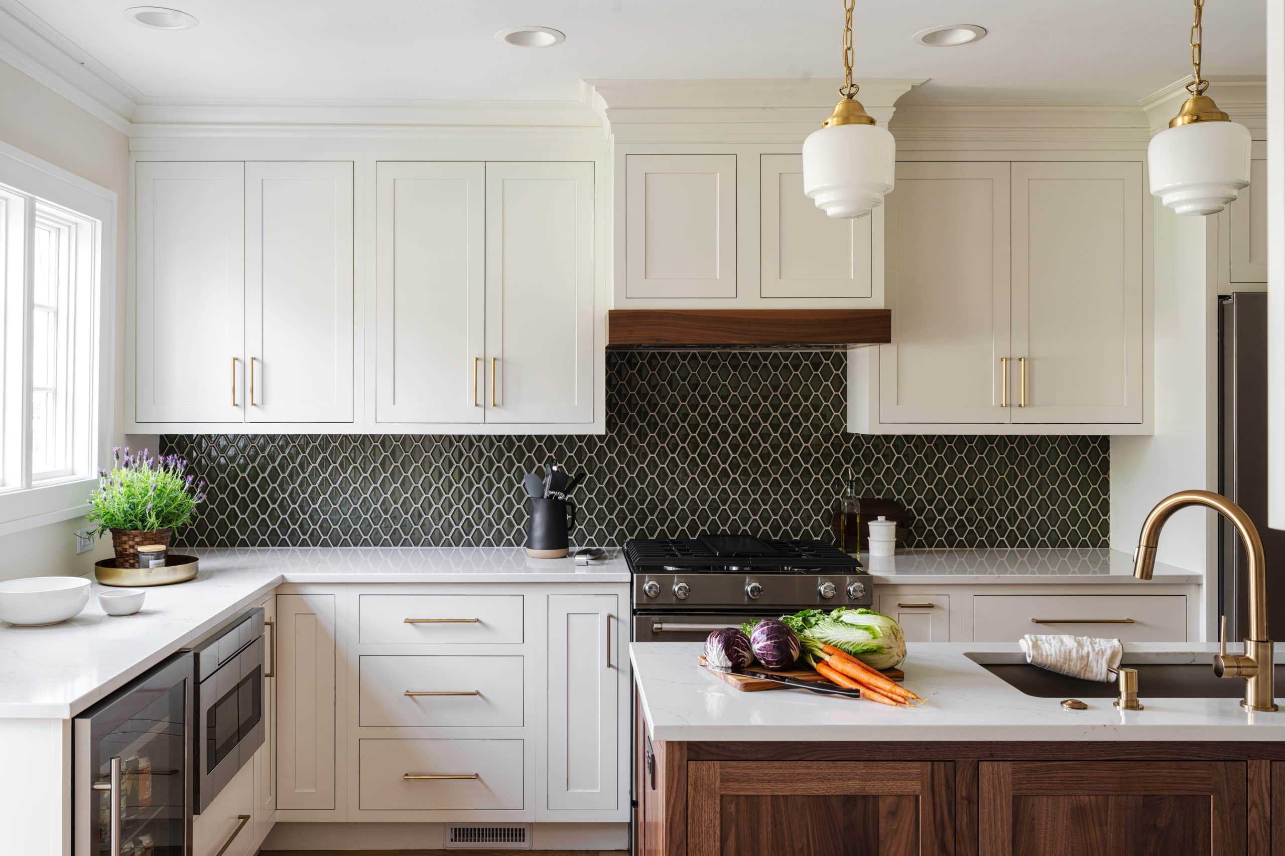 brookside kitchen revival remodeling project with green diamond backsplash tile and white classic traditonal cabinets with gold accents