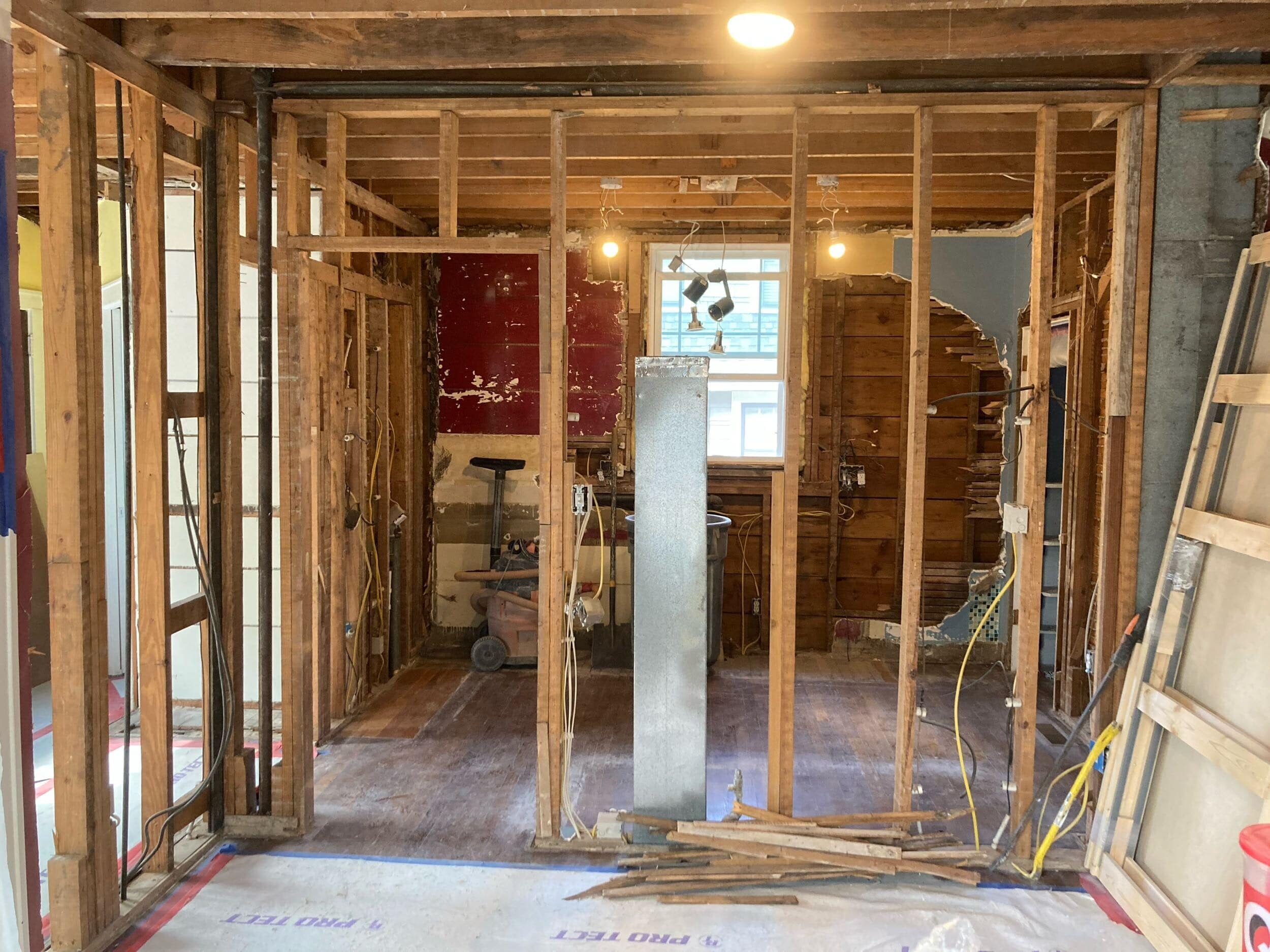 demo of the wall that divides the kitchen and dining room all that remains is some of the framing columns but these will soon go too once we set up new framing to keep it structurally sound