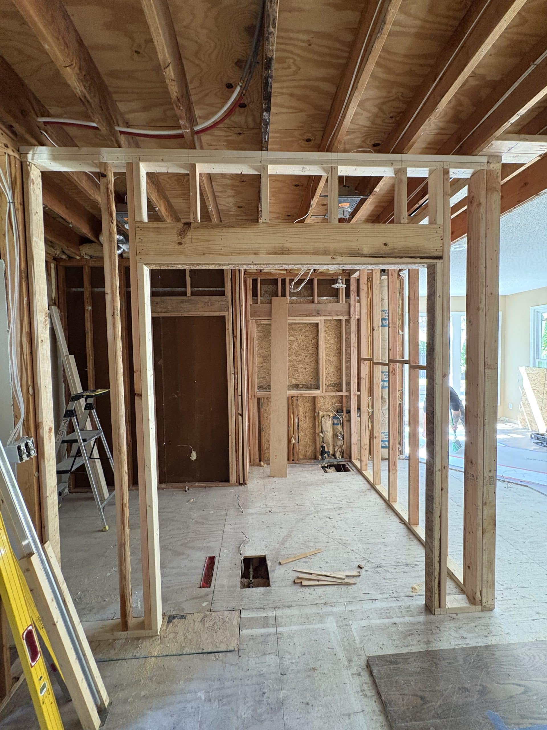 framing view from entrance into office and laundry room