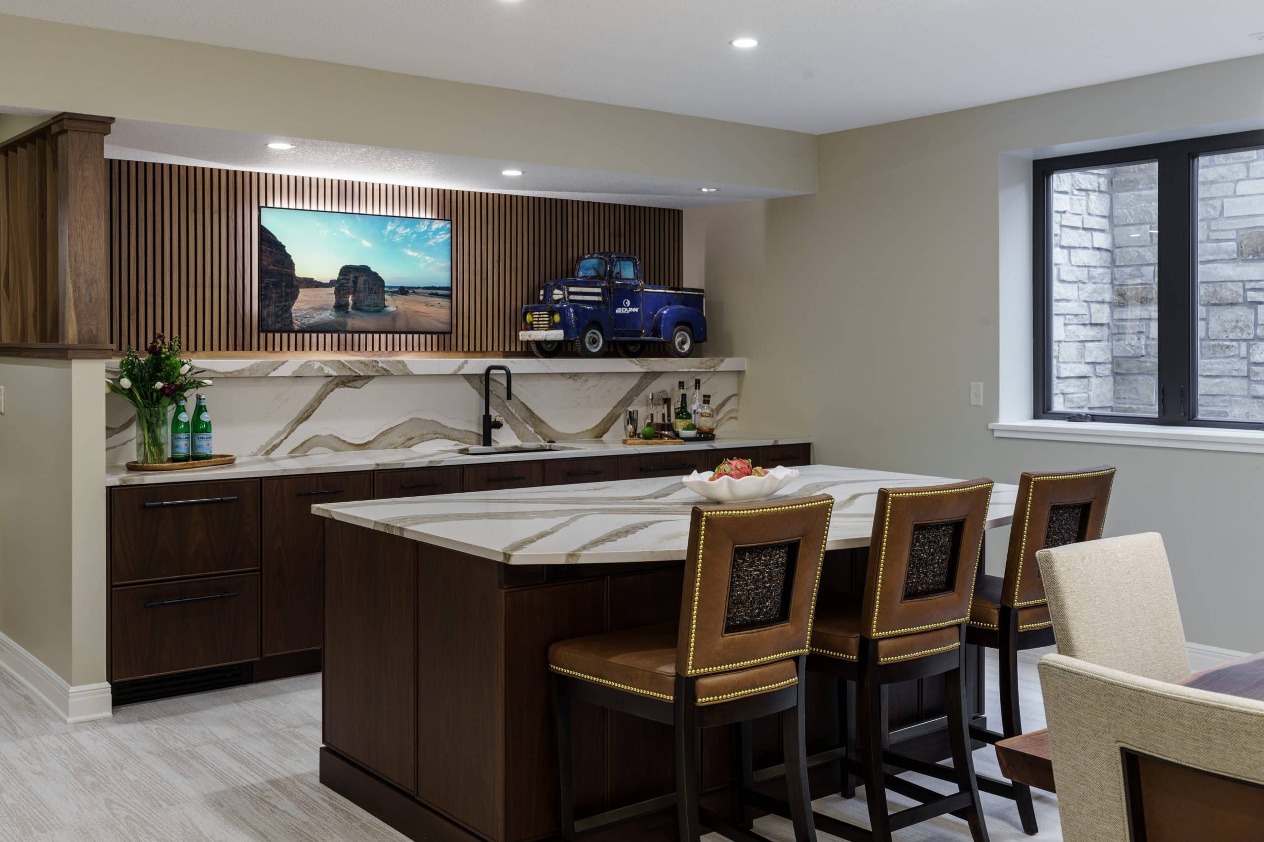 modern sleek basement kitchen and wet bar area with tv for hosting