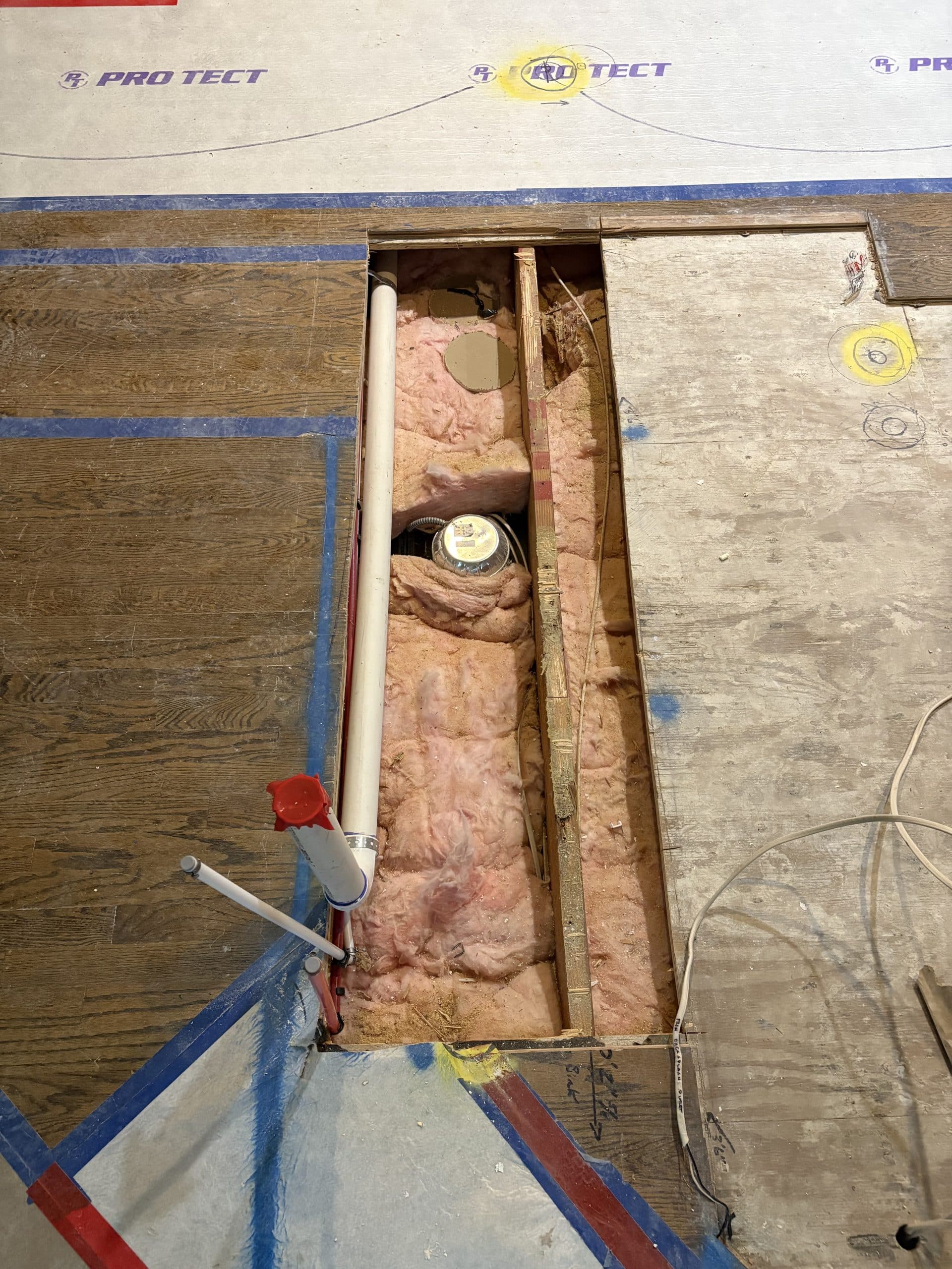 image of the moved pipes in the floor that will be under the kitchen island 