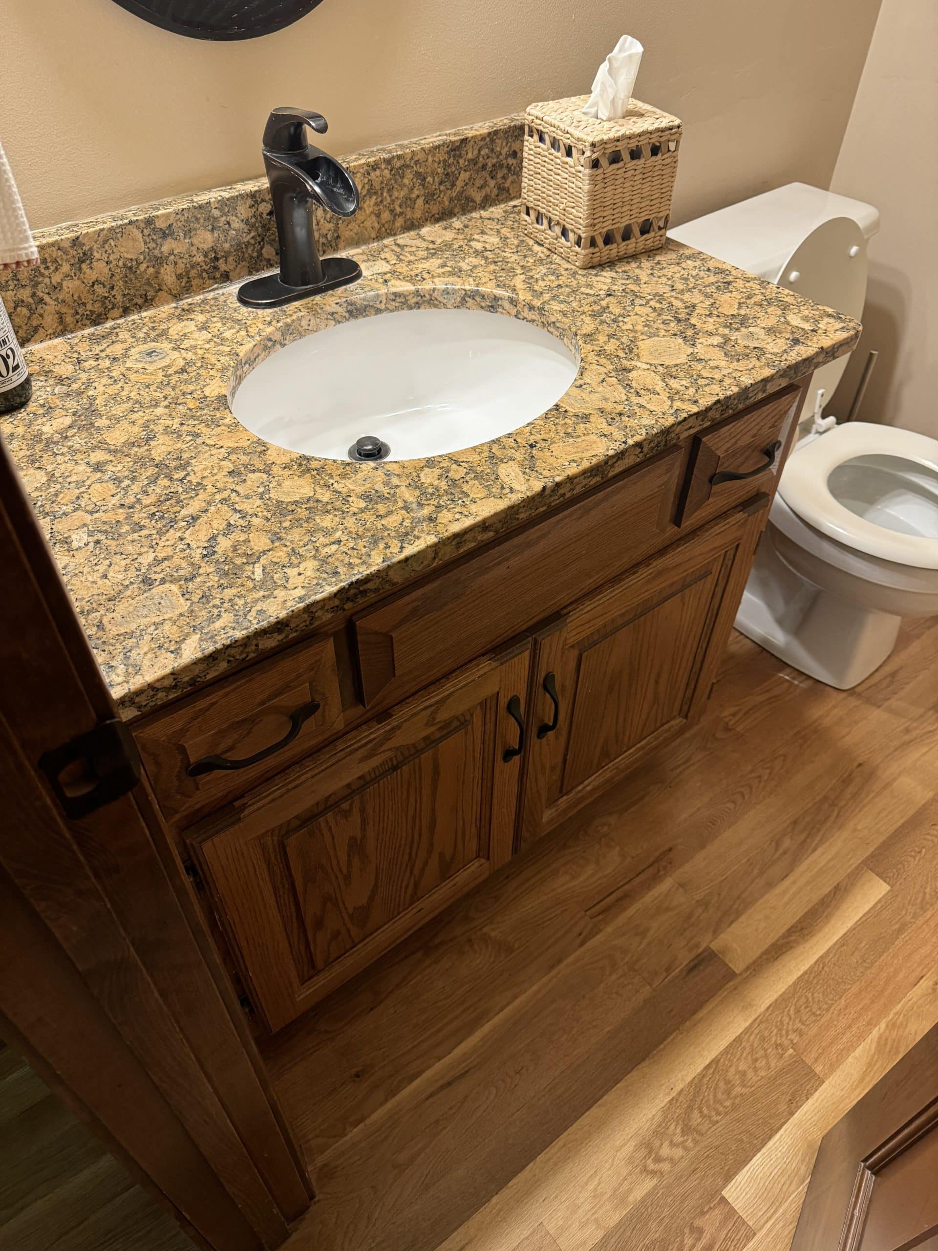 dark and dated powder bath before the remodel its dark and very brown