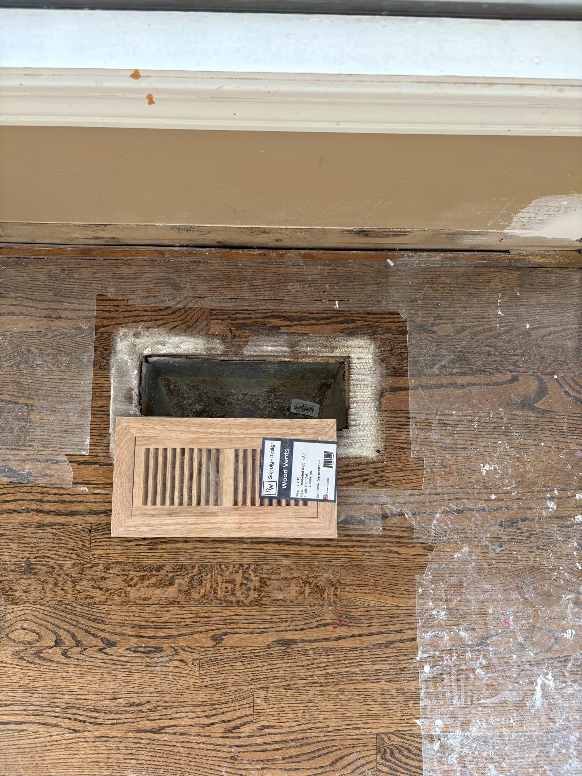 wood vent cover being installed