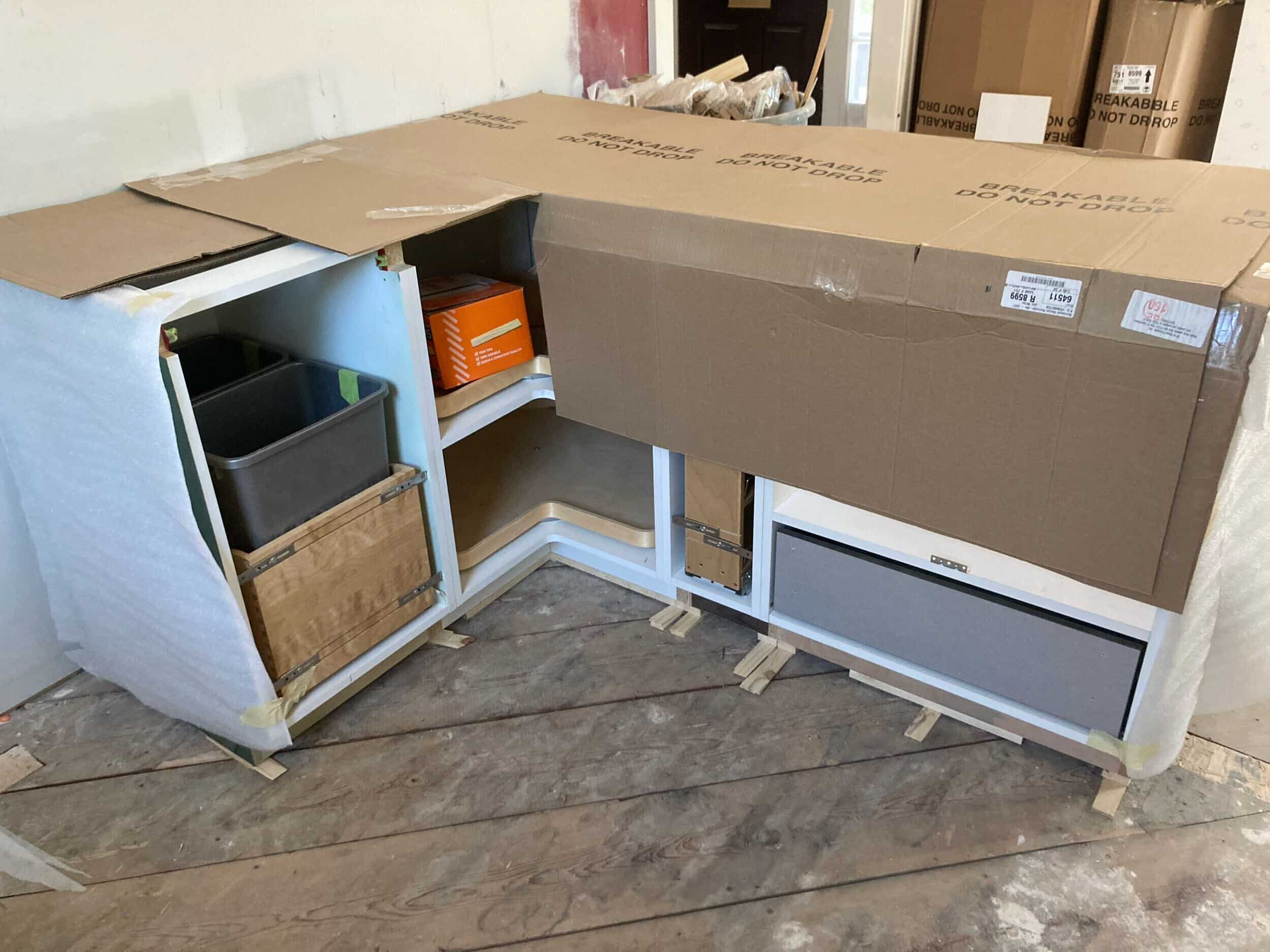 kitchen peninsula island piece of lower cabinets installed that is sleek high gloss green in our brookside kitchen remodel project