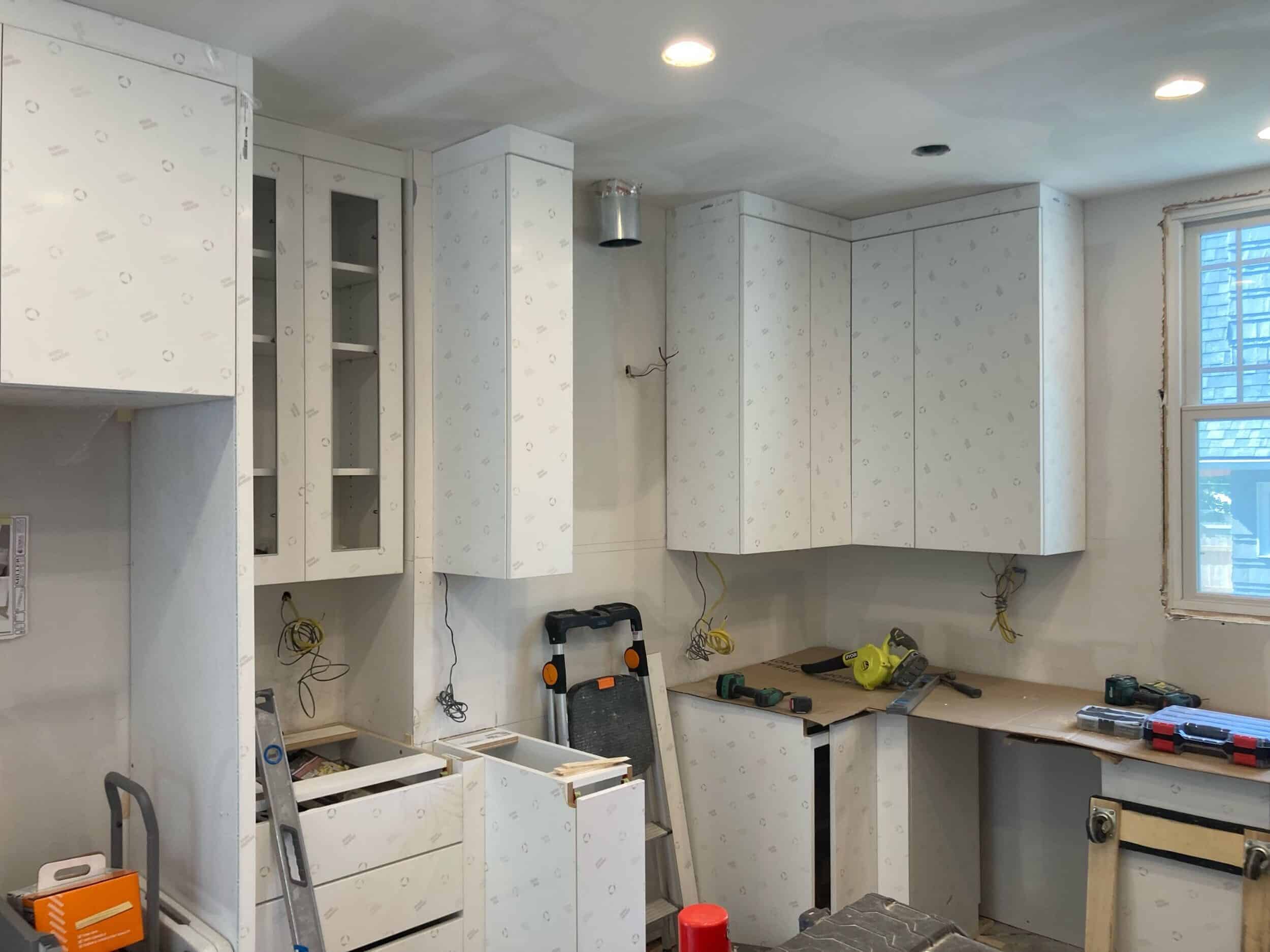 white sleek high gloss custom cabinets installed at our brookside project 