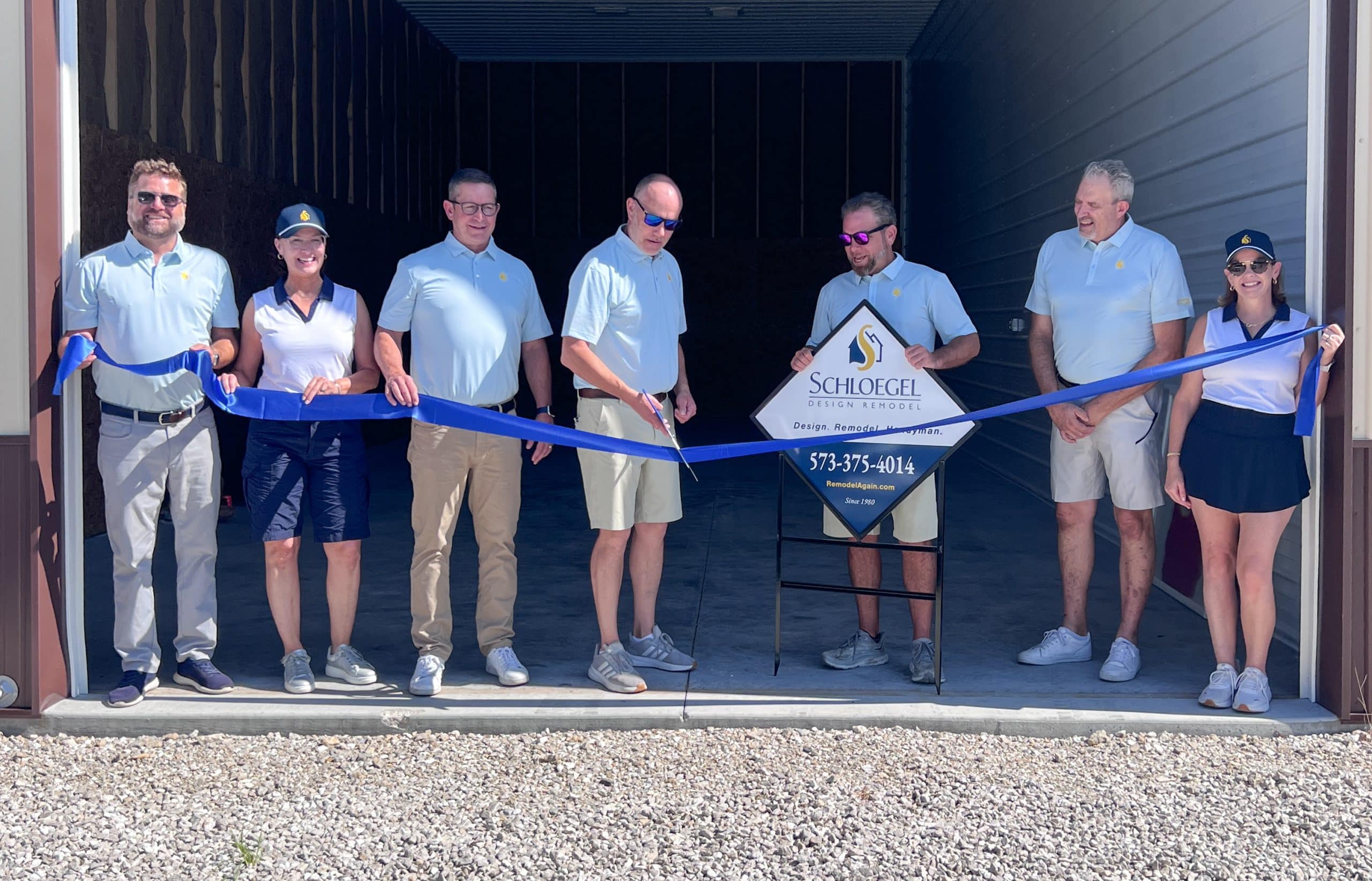 Ribbon Cutting Team cutting ribbon on space at Lake of the Ozarks