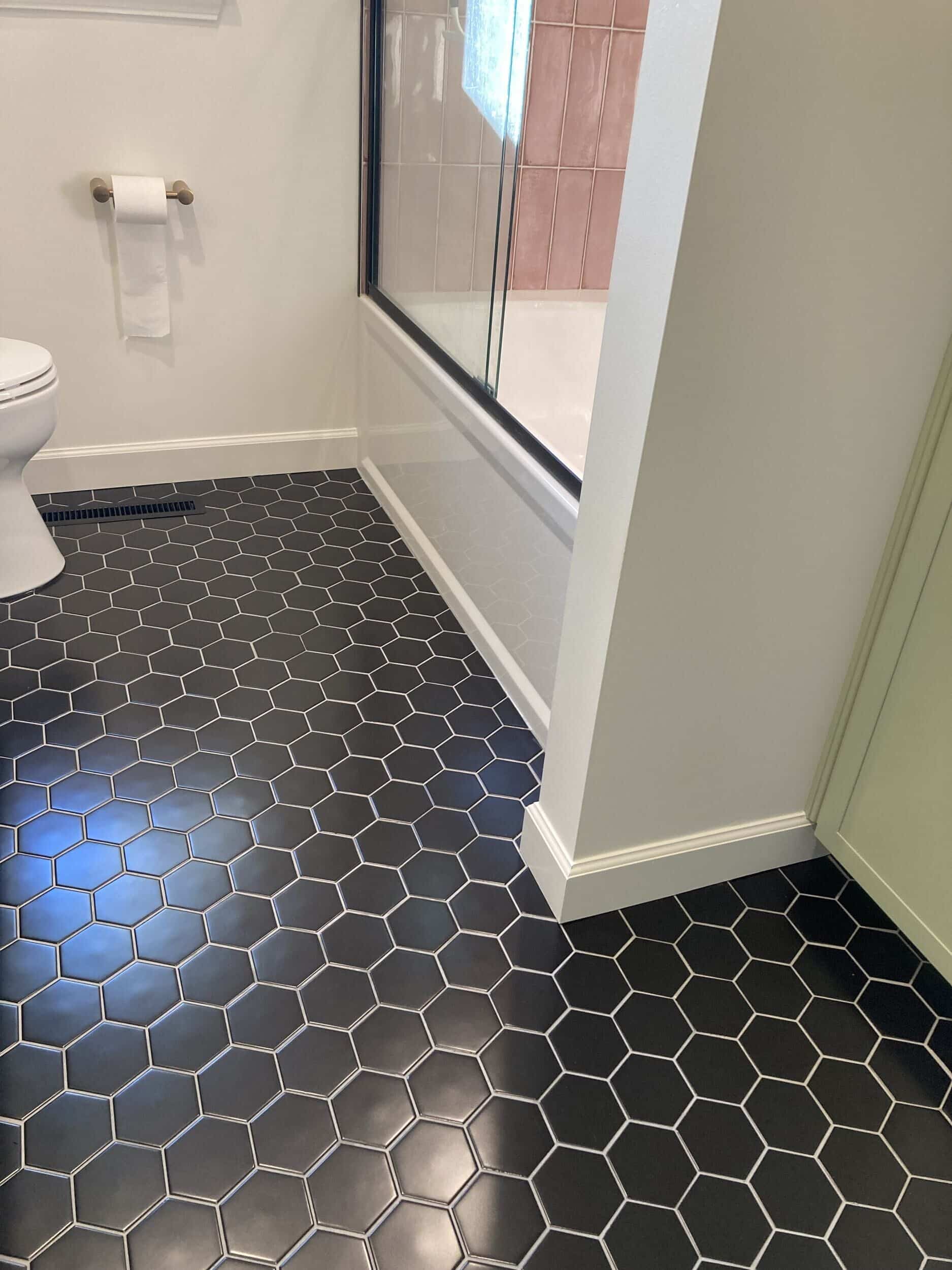 black hexagon floor tile in bathroom remodel