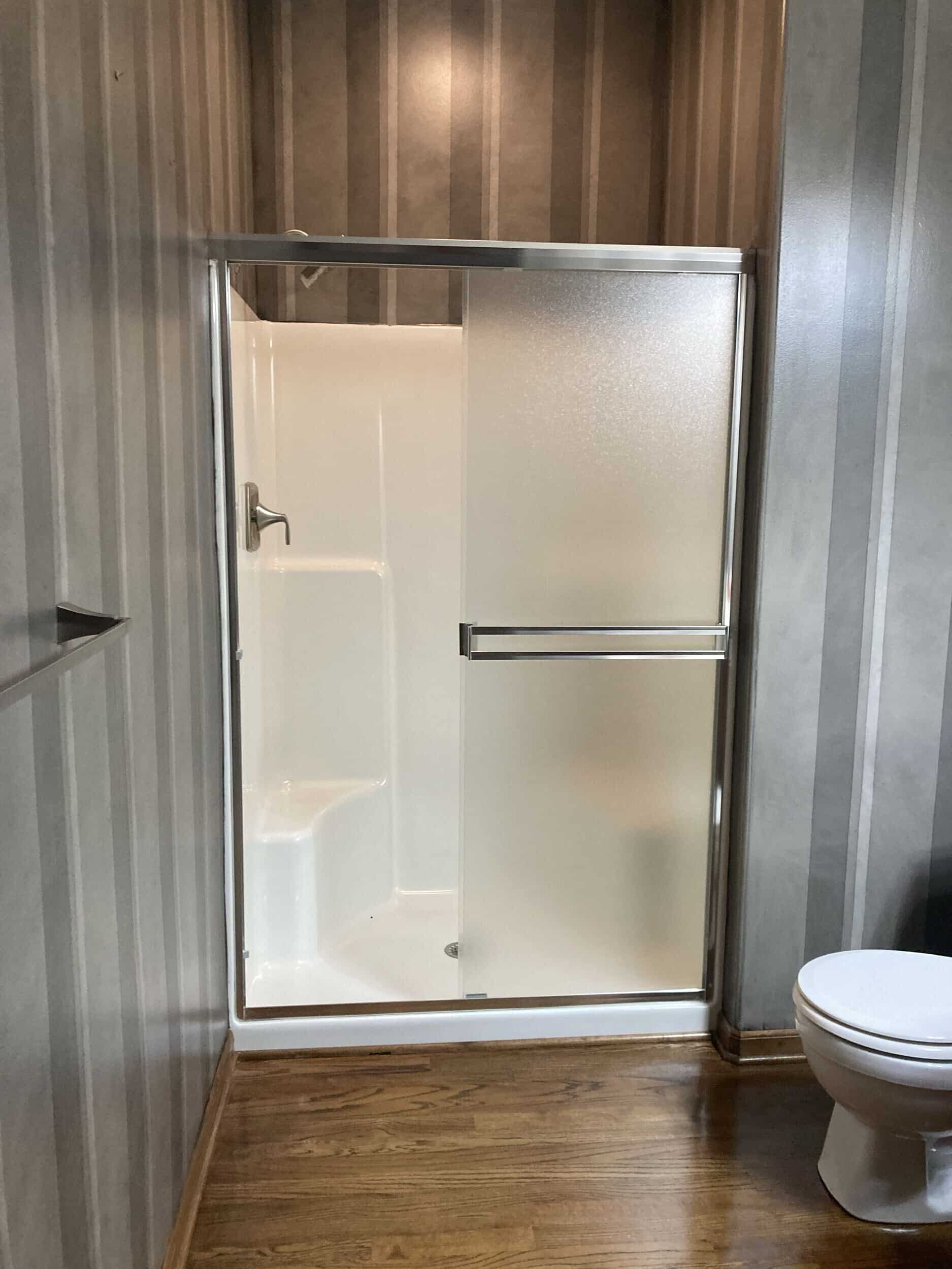 hall bath shower before demo. old school fiber glass shower enclosure