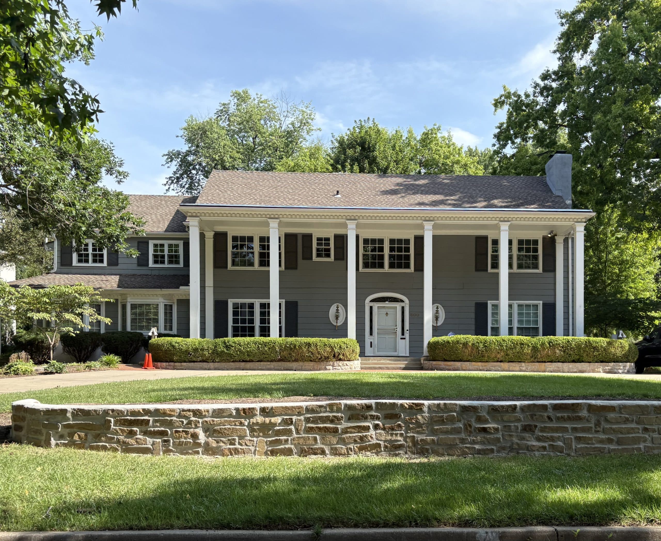 colonial revival old kansas city home with traditional columns in mission hills area