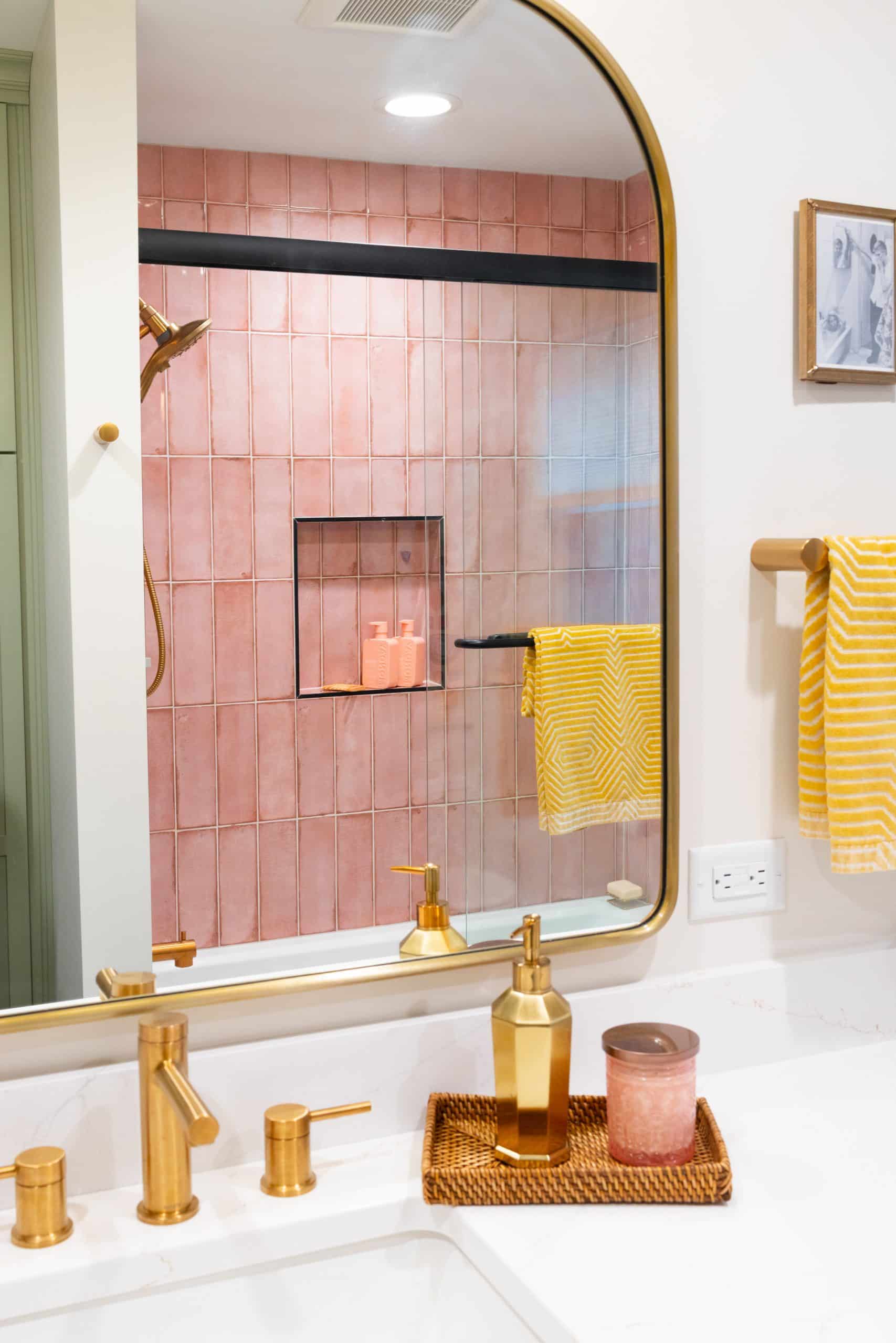 pink shower and green cabinets