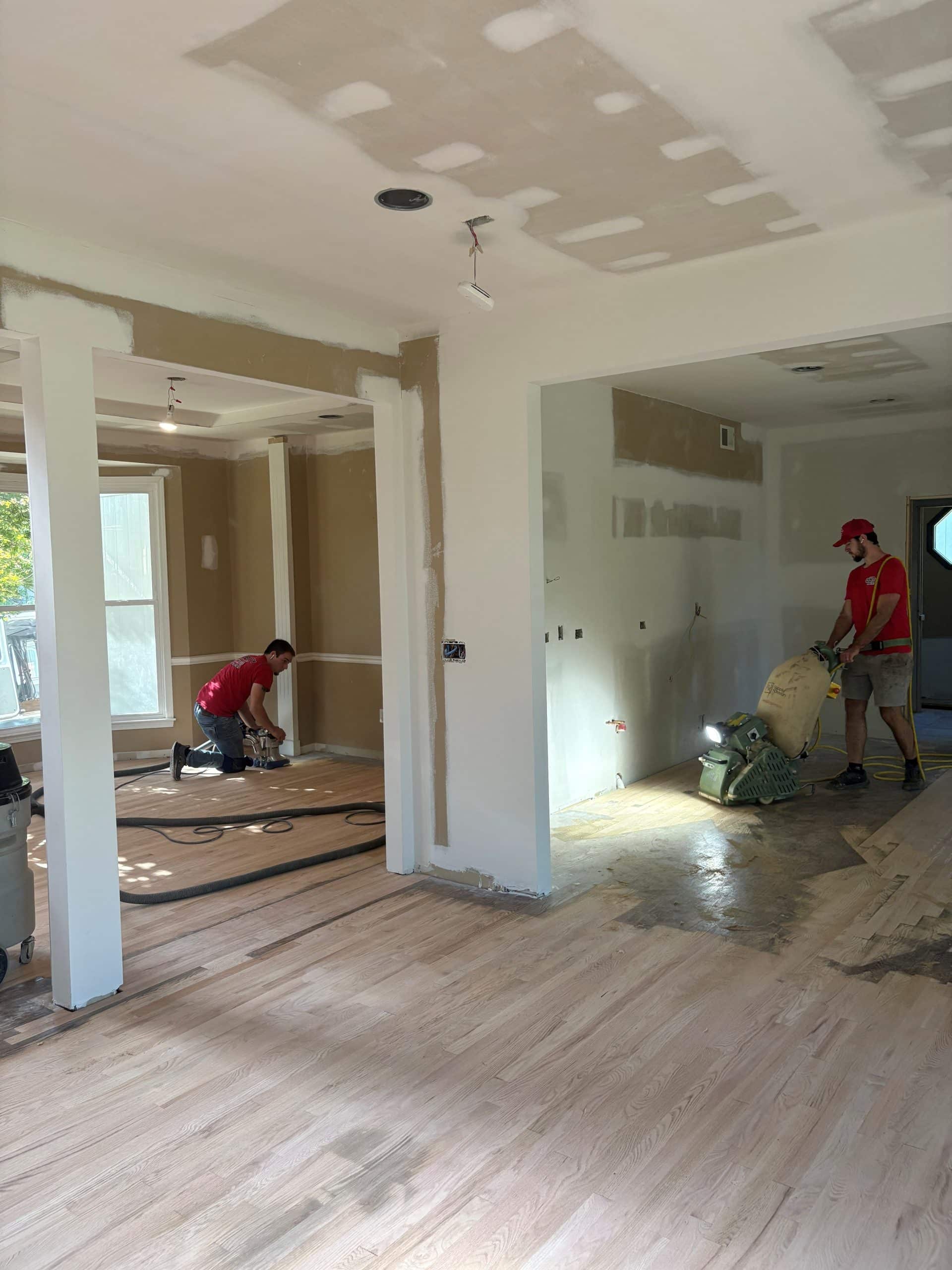 sanding progress on the main floor view into kitchen and dining room