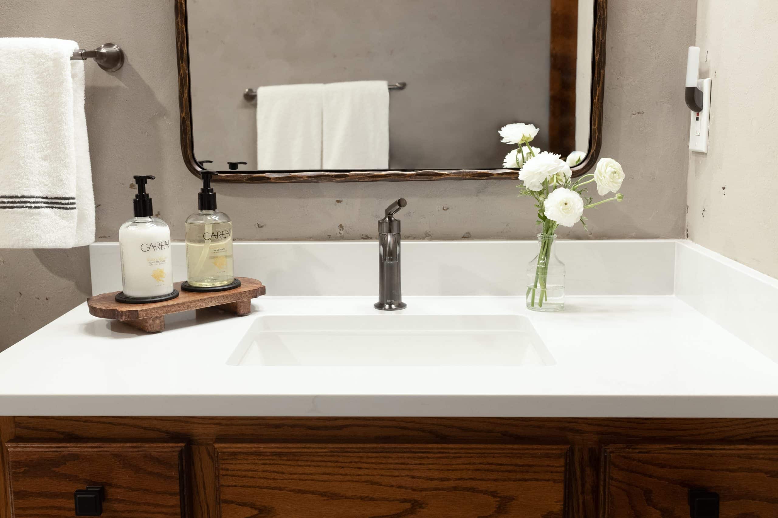 vanity close up with fresh counters and a plaster detail wall texture